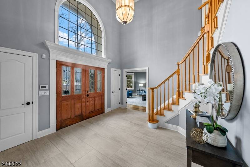 Welcome to this impressive 5 bedroom center hall colonial with 4 full and 2 half baths, plus a three car garage.