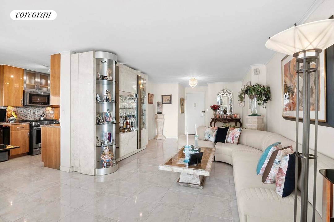 Welcome to this expansive and beautifully renovated, triple mint, 3 bedroom, 2 bathroom coop in the prestigious Americana building at the Towers at Water's Edge.