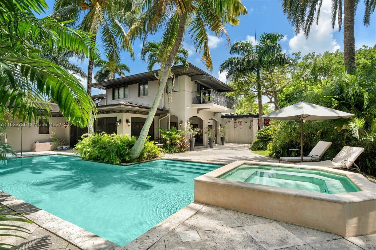 Discover timeless elegance in this magnificent estate, nestled in the heart of a lush, tropical paradise.
