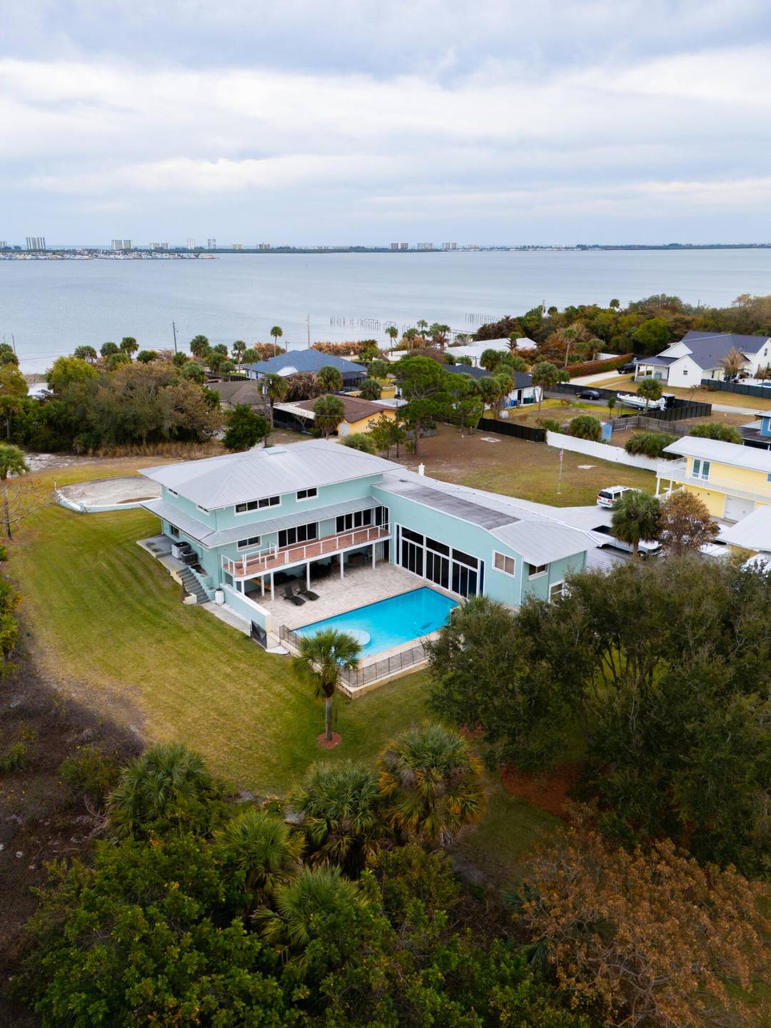 Perched high on peaceful Mockingbird Hill, this exceptional 5 bedroom, 5 full bath estate sits on 1 acre with sweeping Intracoastal water views and a versatile floor plan designed for ...