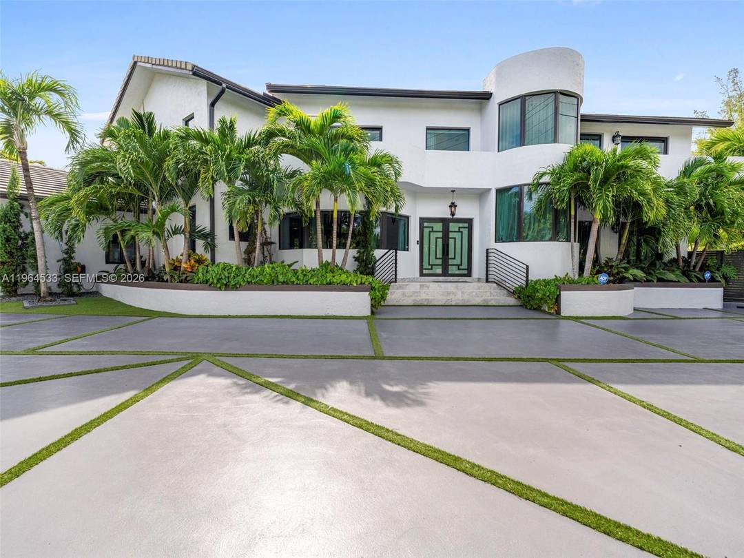Tastefully renovated in 2024, this sophisticated residence is situated on an oversized 12, 000 sqft corner lot in the prestigious Pine Tree Drive corridor.