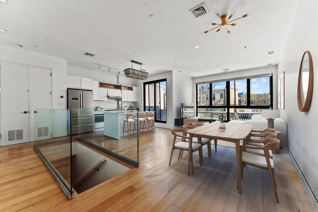 Outstanding and rare Greenpoint triplex condo offering expansive layout, refined finishes, and exceptional outdoor space.