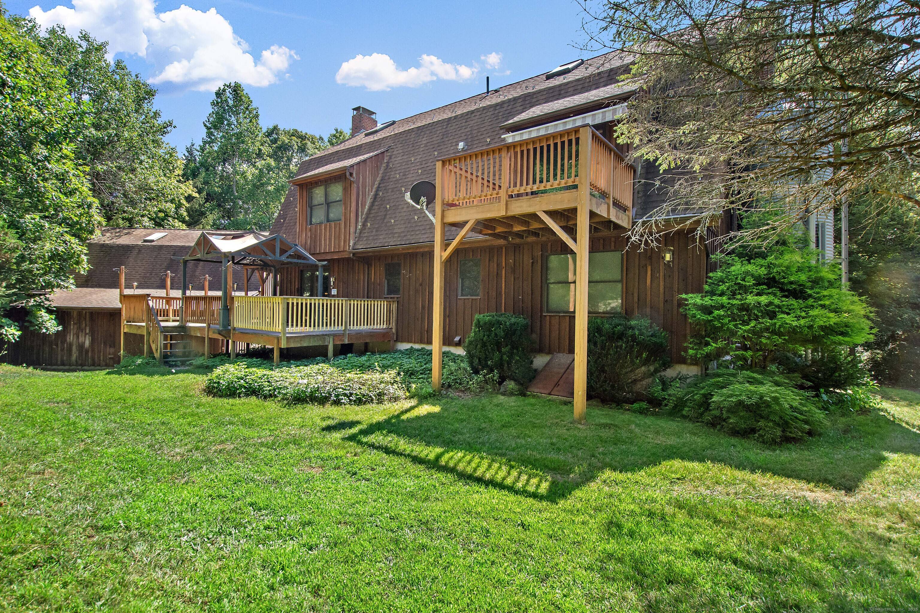Discover this UNIQUE 5 Bedroom, 4 1 2 Bath Gambrel Colonial nestled on 1.