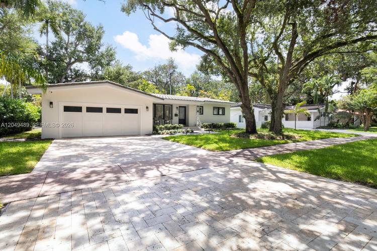 Beautifully updated South Gables home on a charming tree lined street with shaded sidewalks in the coveted Sunset Elementary school district.