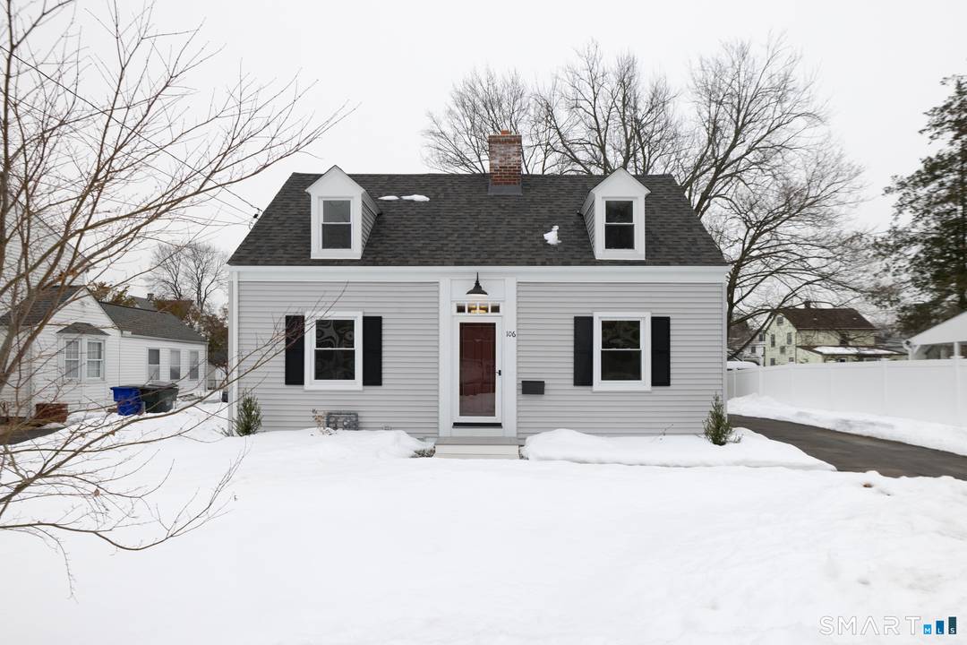 Move right into this beautifully renovated Cape where classic charm meets modern design.
