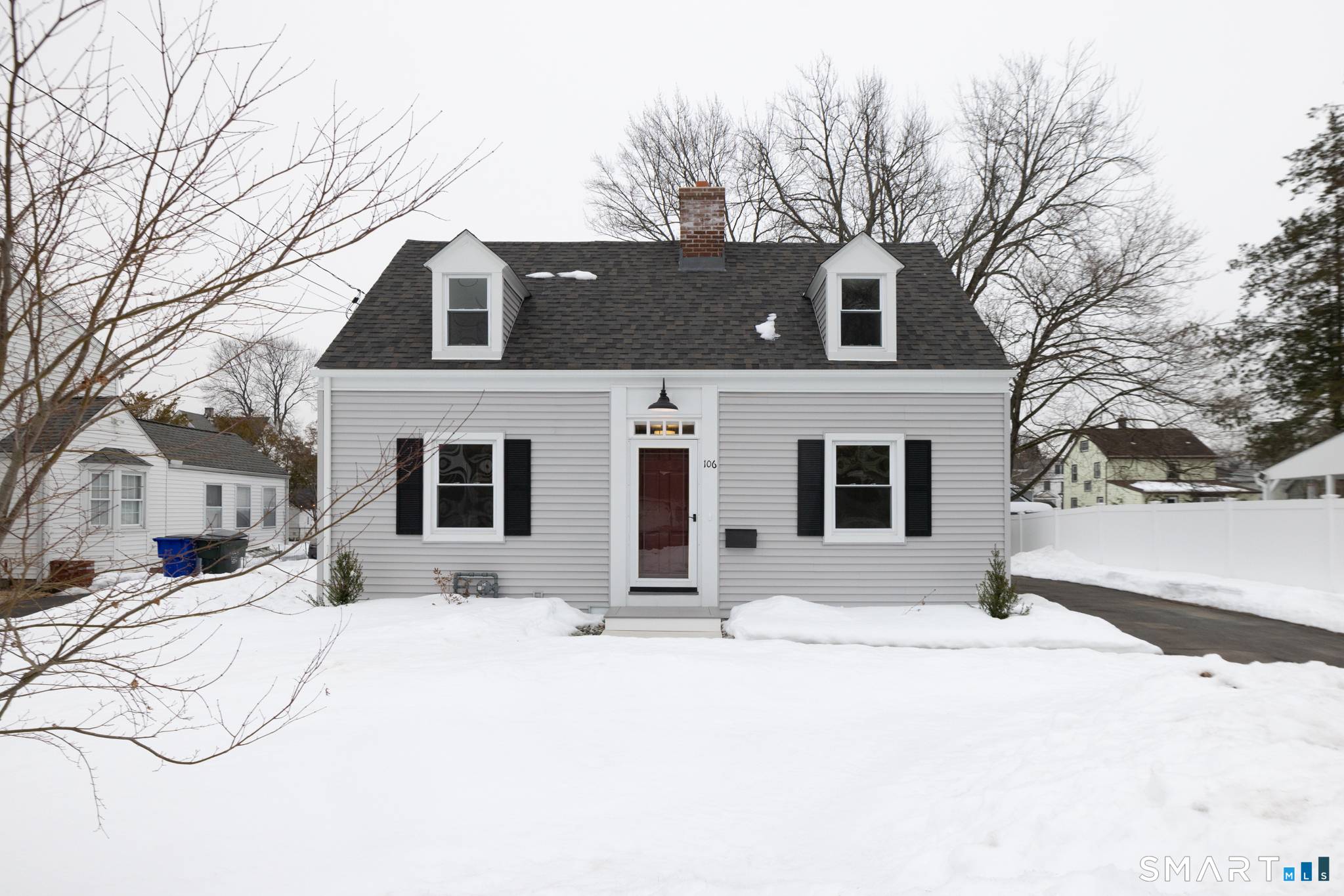 Move right into this beautifully renovated Cape where classic charm meets modern design.