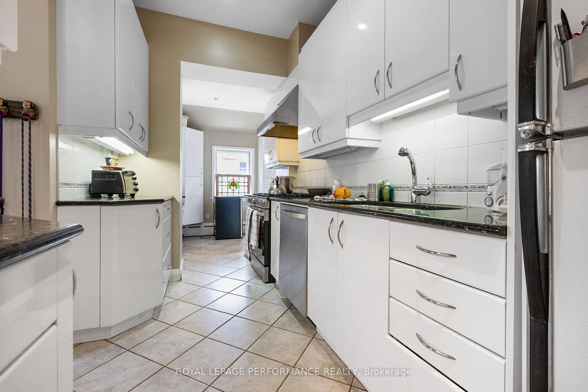 Magnificent, stately 5, 500 square foot Victorian style, all brick, 3 storey Triplex which includes a separate 52 x 116 foot vacant development lot.