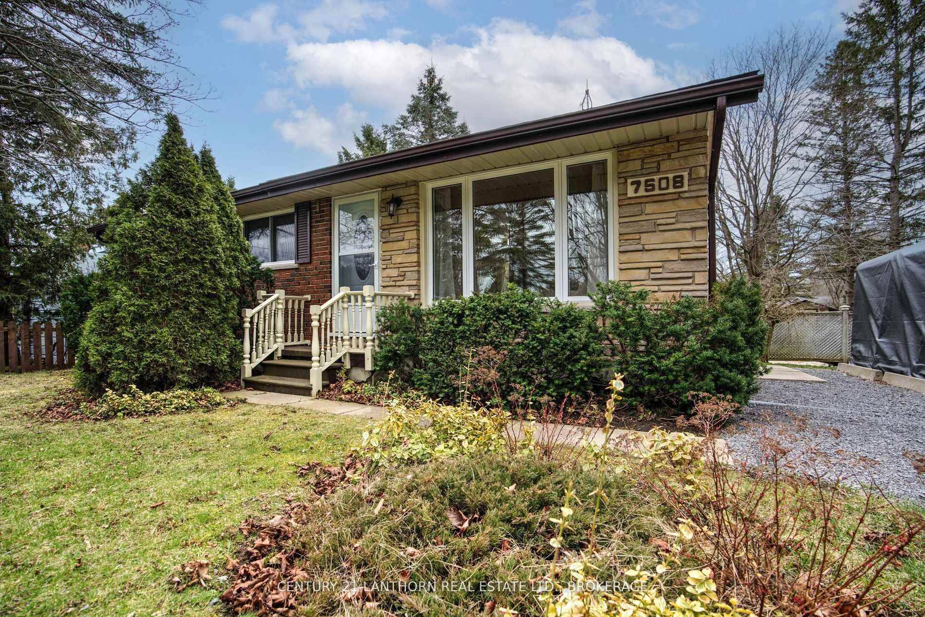 Charming and appealing all brick bungalow on a large, well manicured lot just minutes from town !