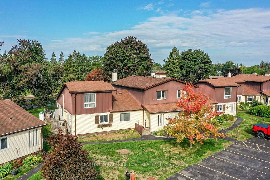 Experience The Charm of Waterfront Living in this Beautifully Updated Home, Featuring Two Spacious Bedrooms and a Sunlit Livingroom Complete with a Cozy Fireplace.