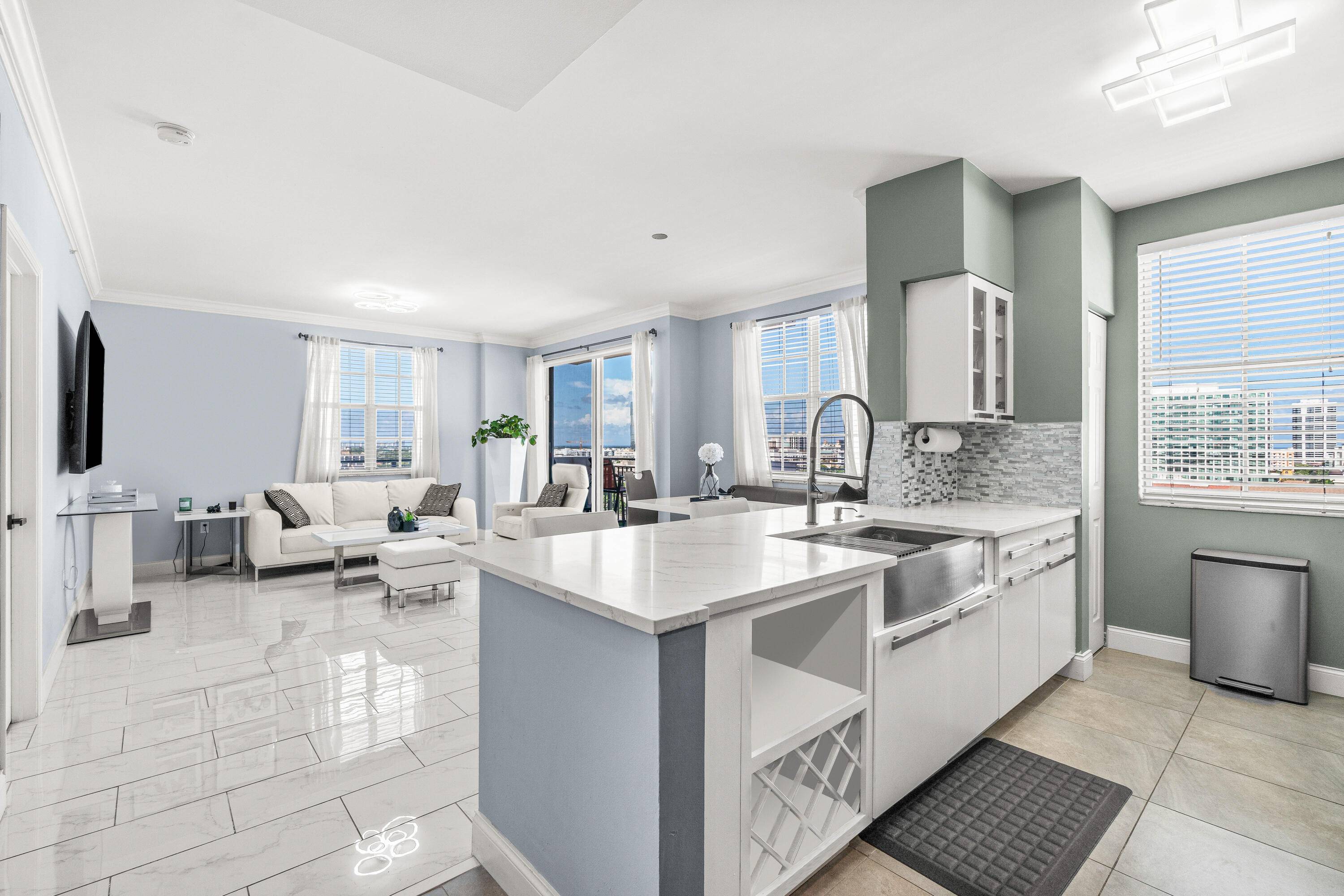 Experience breathtaking sunrise and sunset views along with ocean breezes from your private balcony on 14th floor in Downtown West Palm Beach !