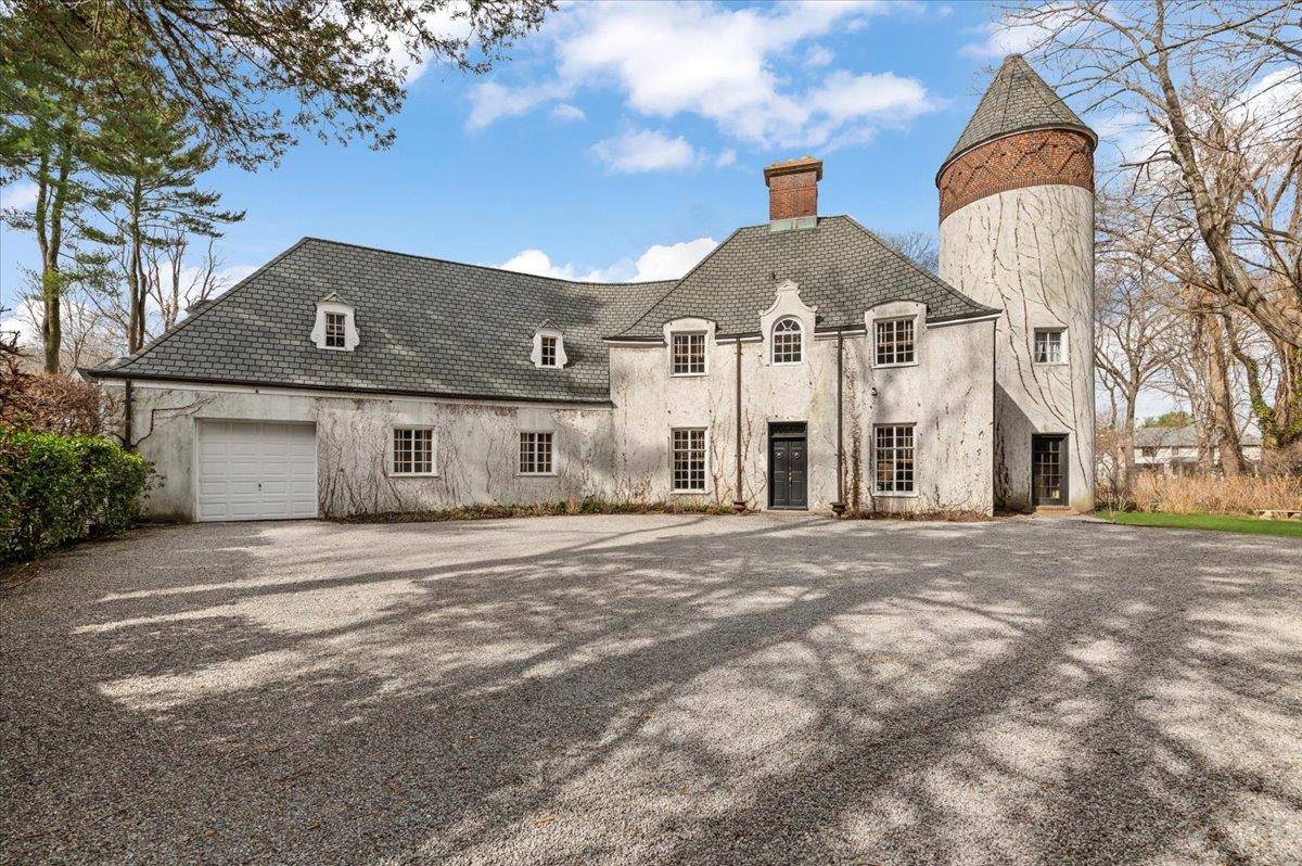 Step into a timeless retreat where elegance meets tranquility in this one of a kind gated estate in the heart of Muttontown.
