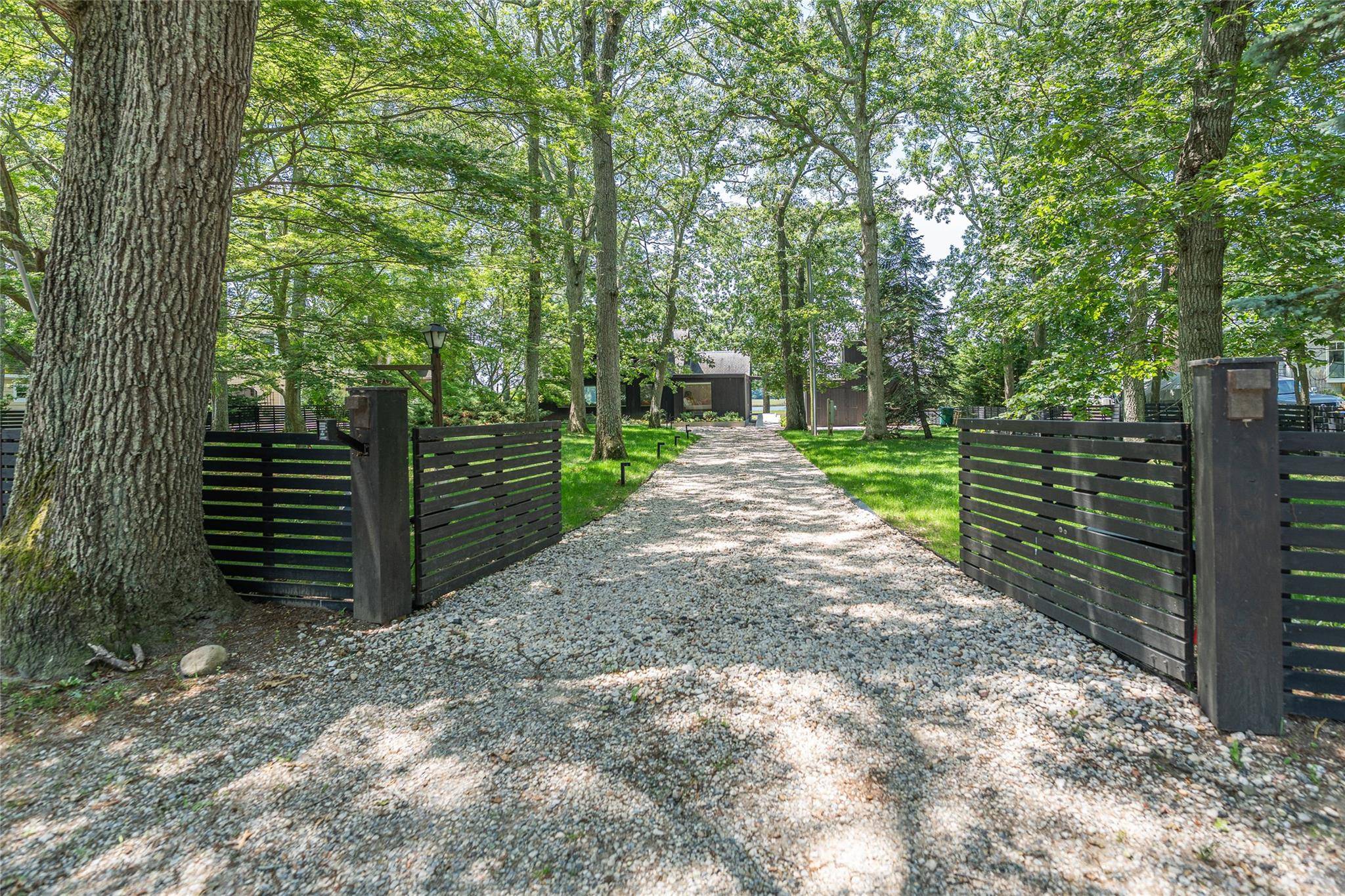 This sleek, immaculate, modern renovation with floor to ceiling glass offers the perfect summer rental, WOW factor !