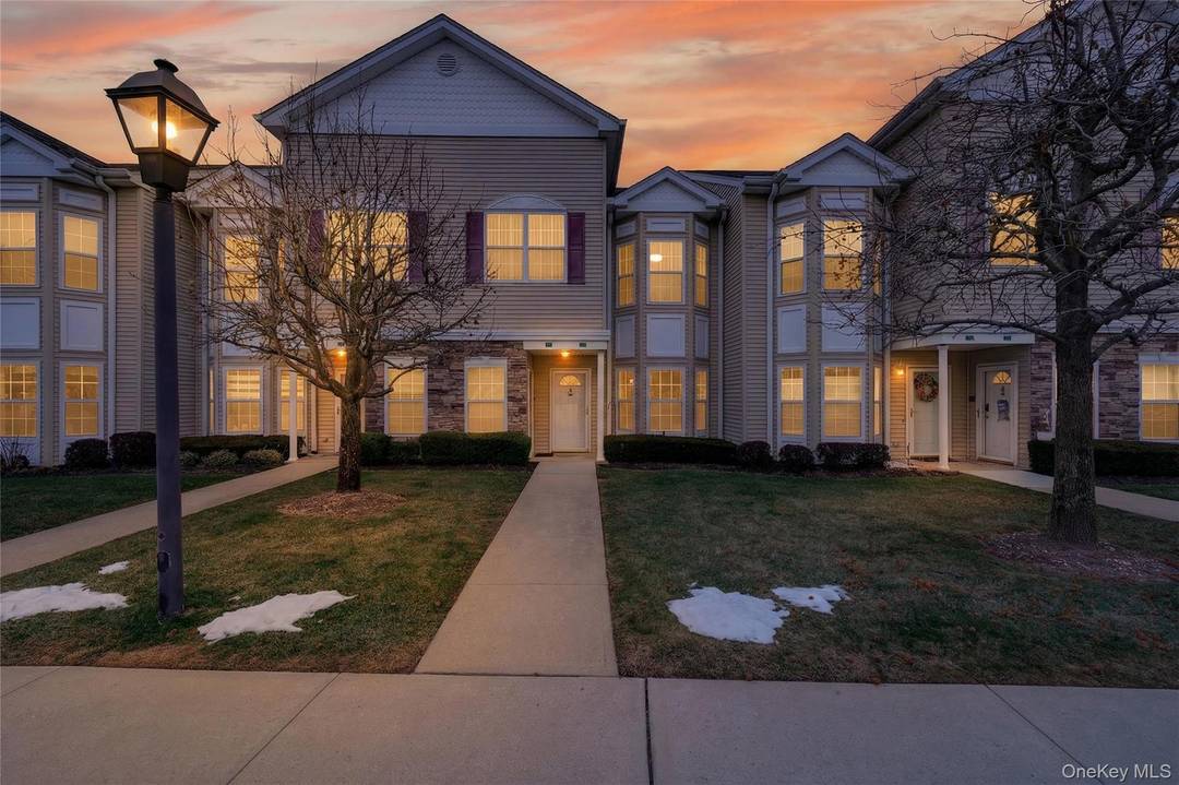 First floor condo living at its finest at The Seasons in East Meadow.