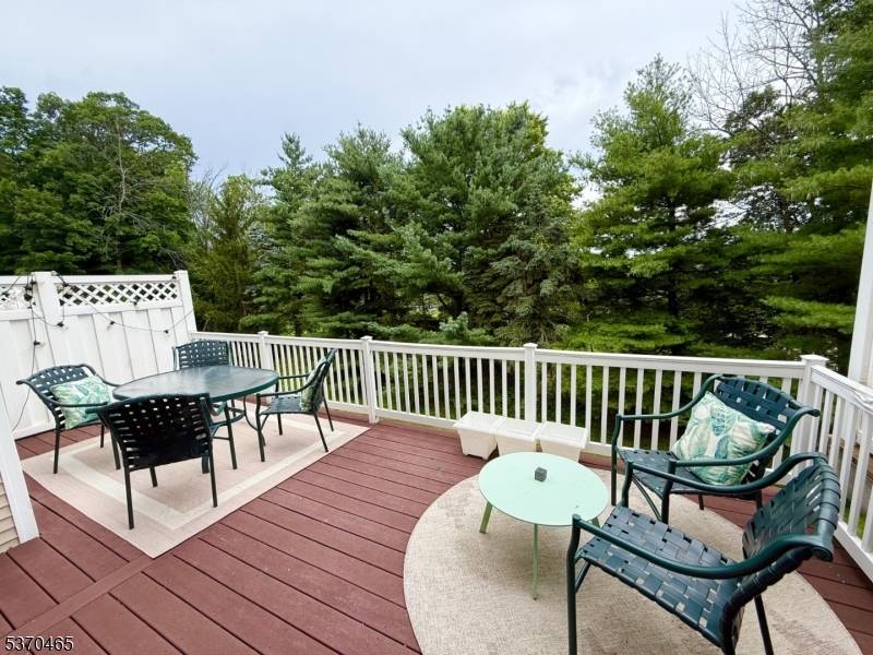 Nestled in a peaceful cul de sac and backing to a lush, wooded area with glimpses of the golf course just beyond the trees, this beautiful 3 bedroom, 2.