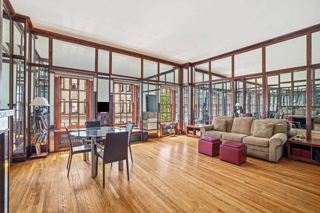 Charming top floor studio in an elevator townhouse on a prime Upper East Side block.