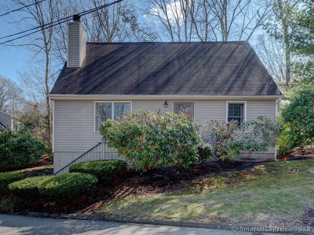 Welcome to 20 Copper Hill Drive where city convenience meets coastal charm.