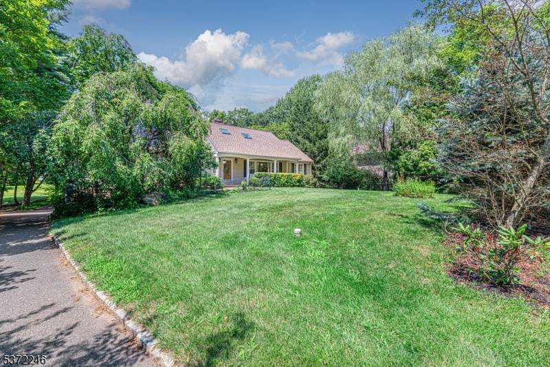 Immaculate custom 10 room home situated on a serene and private lot, this exceptional residence offers a refined living experience with 4 spacious bedrooms and 3 full baths.