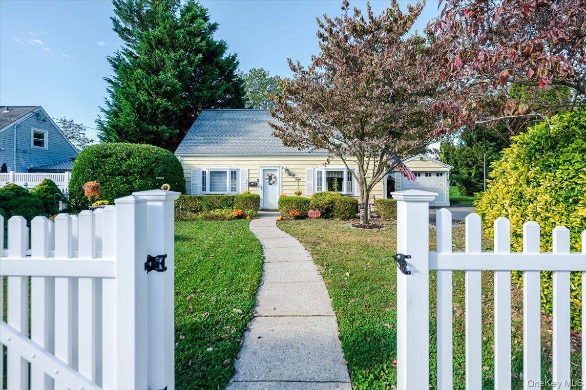 Welcome home to a must see charming 3 bedroom, 1 bath Cape style home, white picket fence and all.