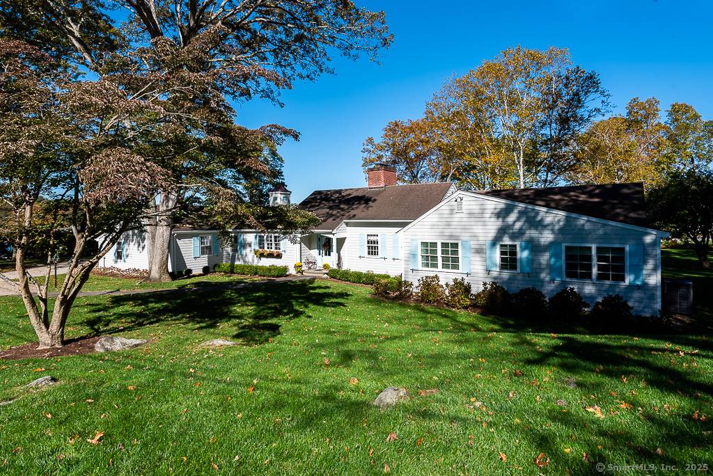 A sprawling luxury home offering one level living with stunning views of South Cove and quintessential Essex village beyond.