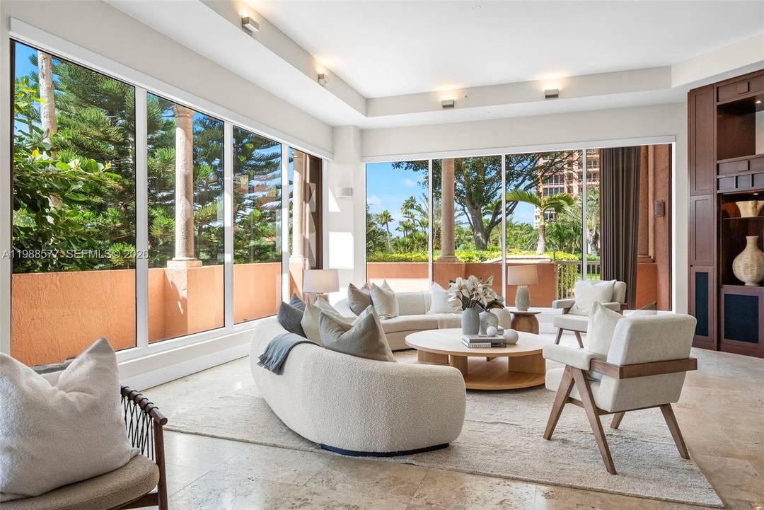 Nestled within the prestigious Gables Club, this exceptional Lanai South residence offers a rare blend of space, privacy, and effortless indoor outdoor living in the heart of Coral Gables.
