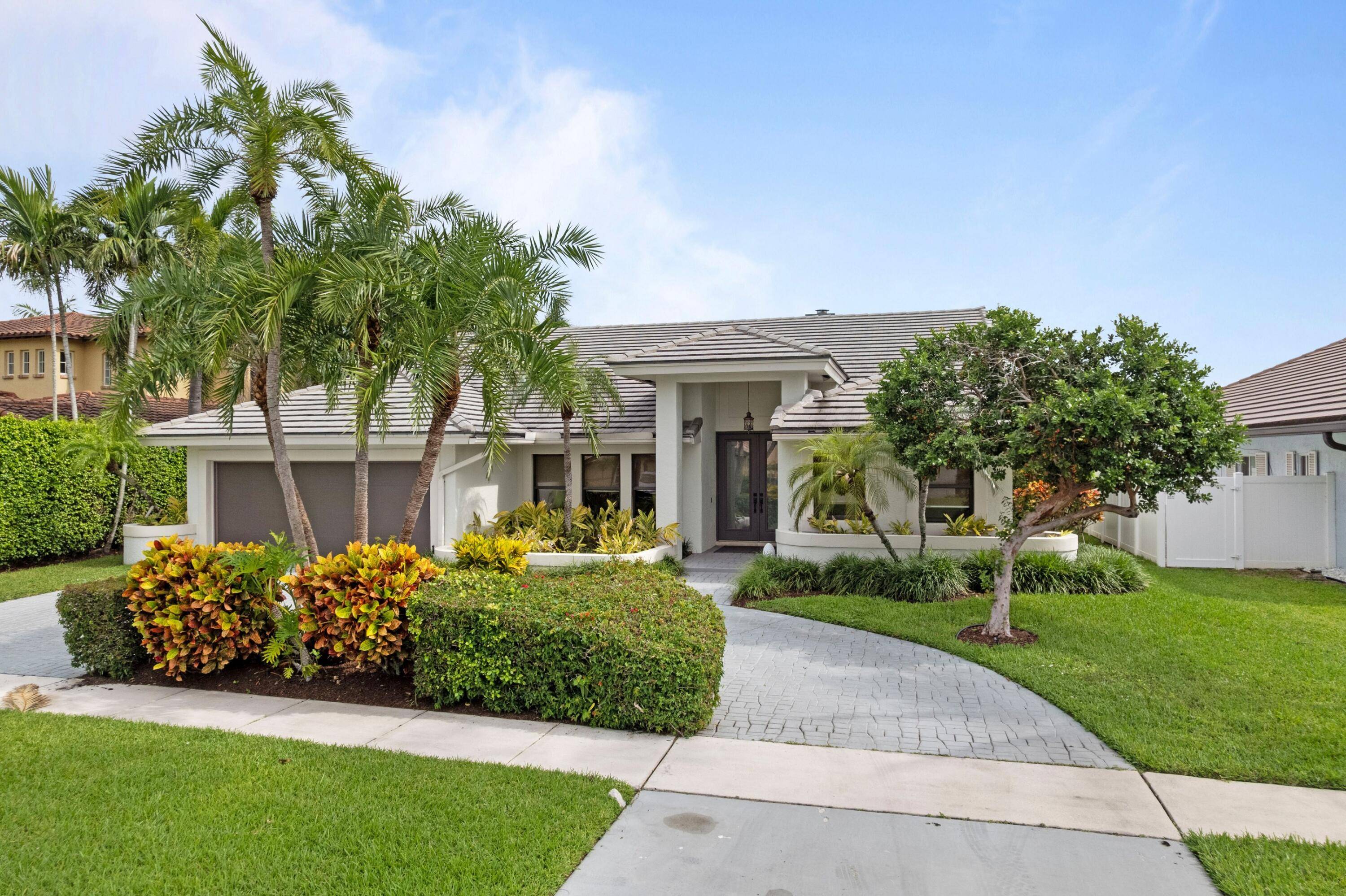 ABSOLUTELY GORGEOUS WATERFRONT ESTATE BREATHTAKING CANAL VIEWS PRESTIGIOUS EAST BOCA'S HIDDEN VALLEY EXQUISITE HIGH END QUALITY WORKMENSHIP Double Door Entrance Bright Open Split Floor Plan LED Recessed Lighting Dramatic Vaulted ...