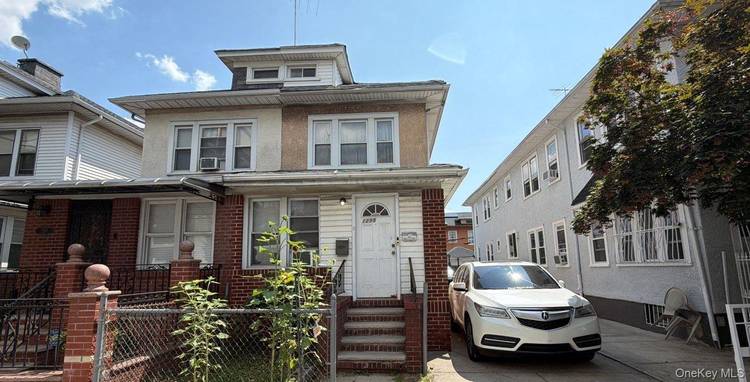 This 2 Family Colonial Style Home Features 3 Bedrooms, 2 Full Baths and 1 Car Garage.
