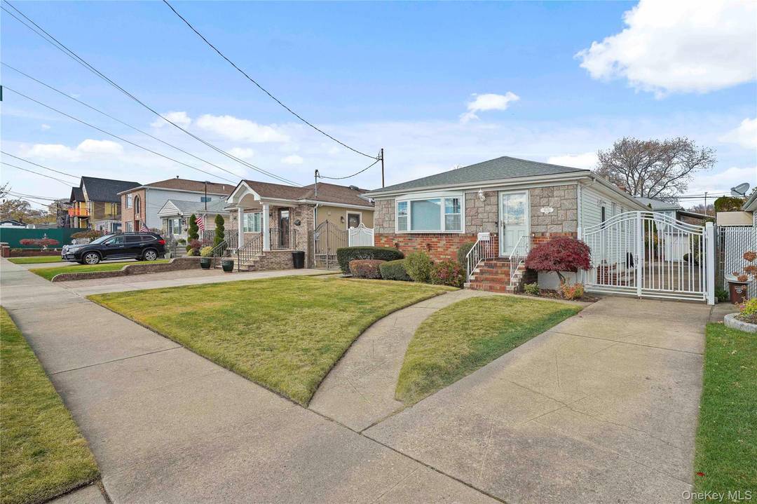 Welcome to this beautifully updated brick ranch featuring a welcoming living room, dining room, solid wood floors throughout and open layout perfect for both everyday living and entertaining.