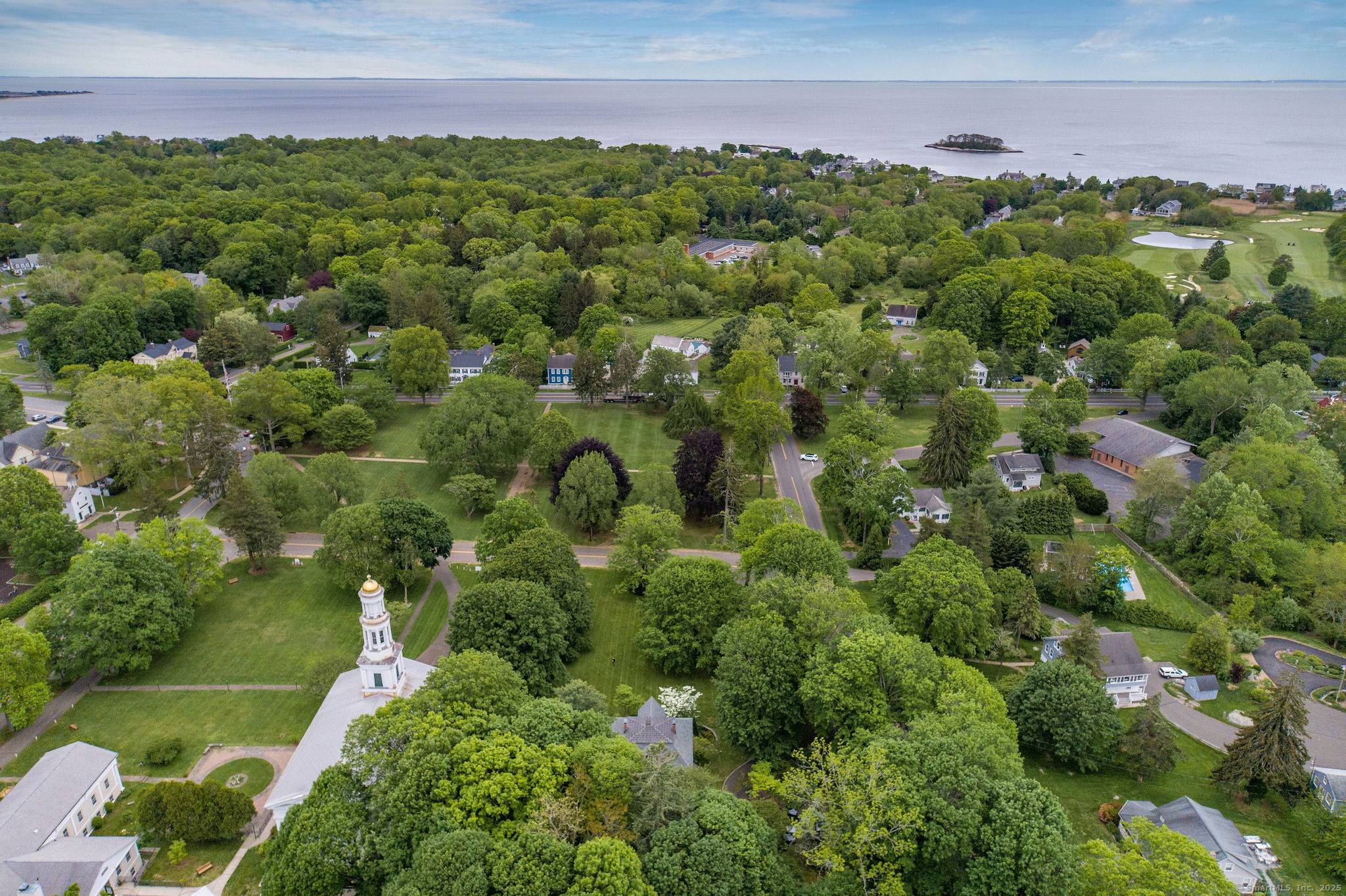 Once known as Hartsbourne, this storied Madison residence is celebrated for its premier location overlooking the town green and its timeless architectural presence.
