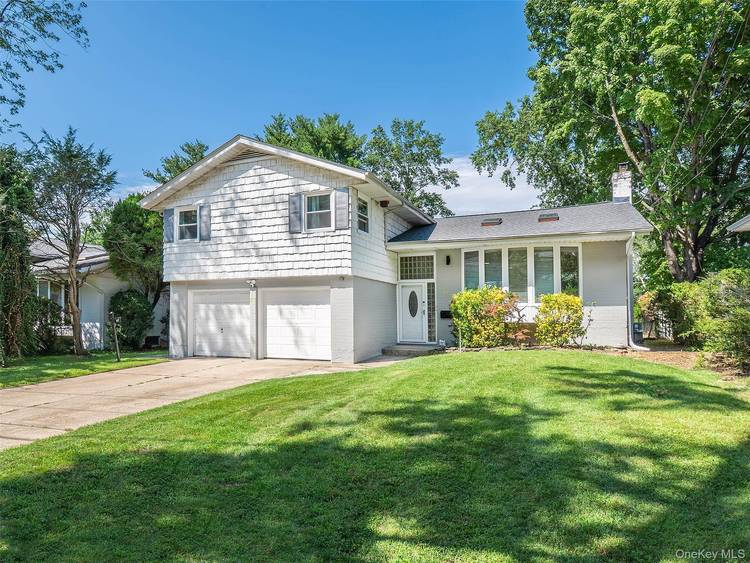 Beautiful 4 bedroom, 3 full bath split level home with open floorplan in excellent condition, set on a large property.