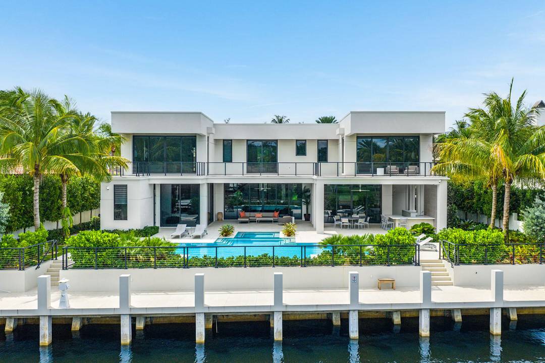 A masterpiece of modern waterfront living, this nearly new 2024 estate by SRD Building Corp.