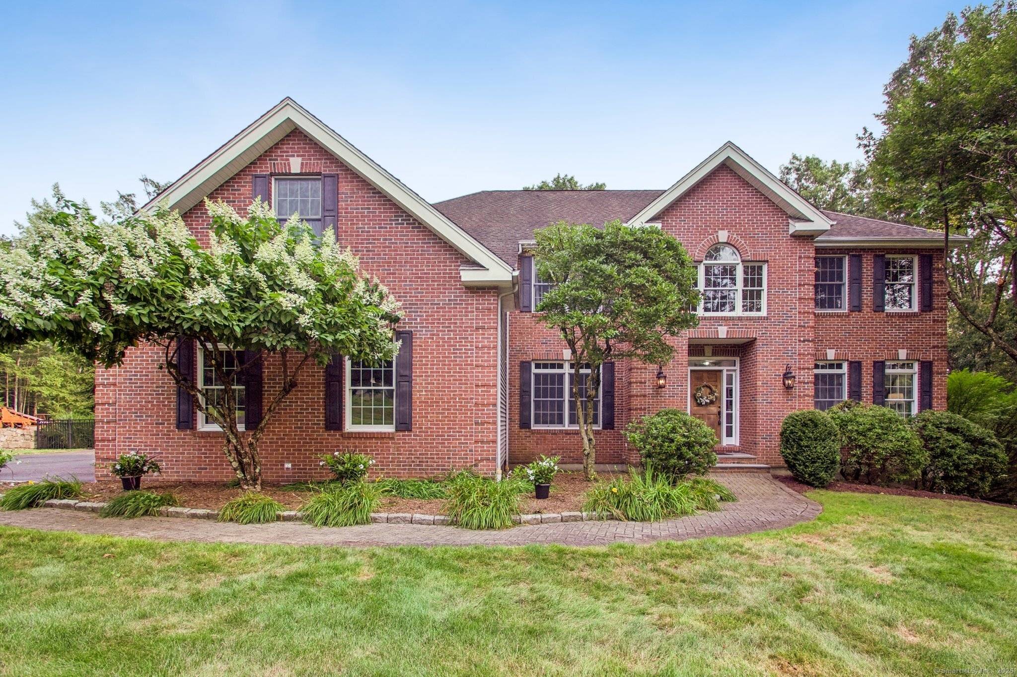 Welcome to 40 Pleasant Drive, Southbury, CT, a picturesque Colonial nestled in a peaceful, tree lined neighborhood.