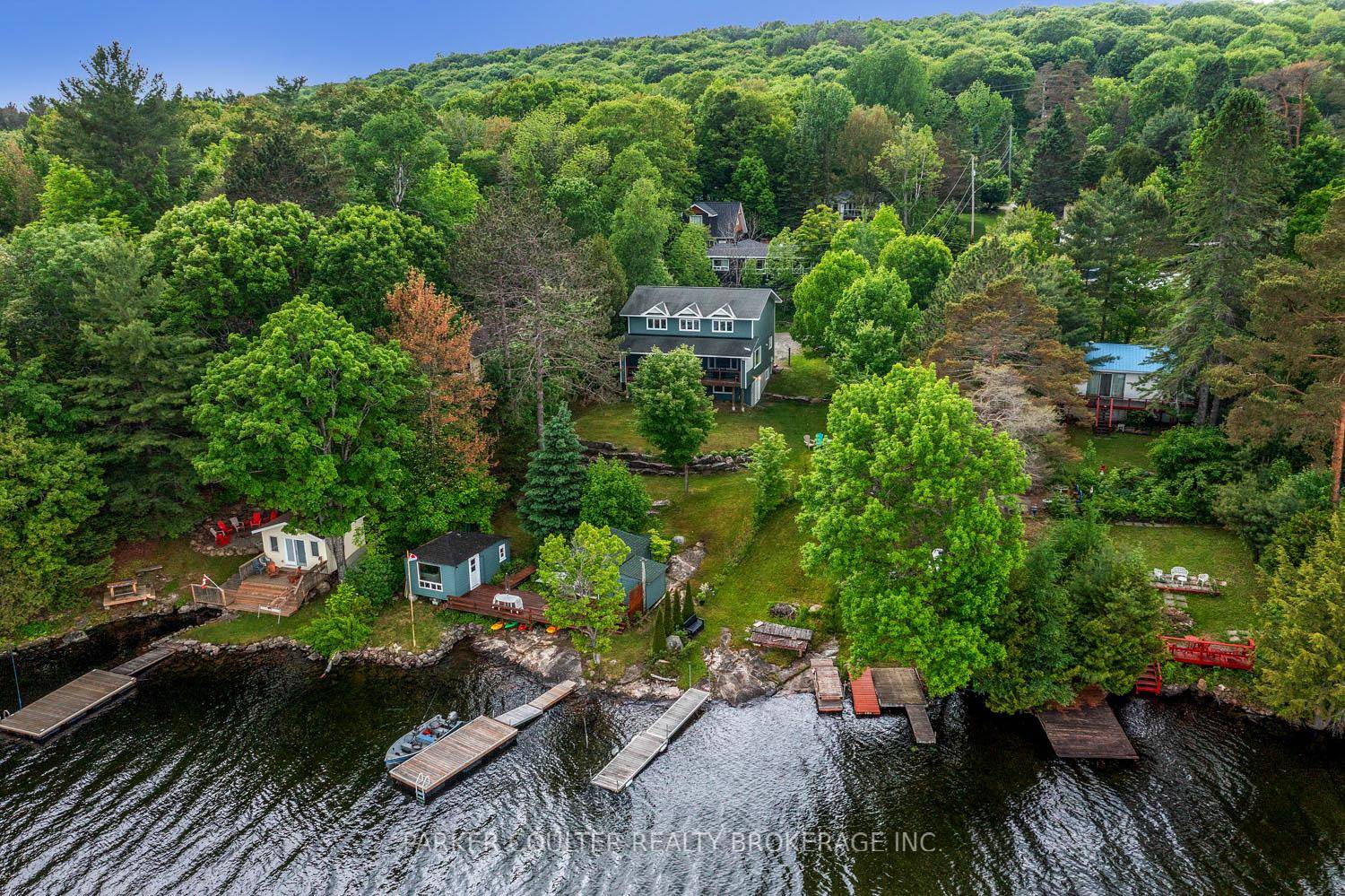Enjoy year round living on beautiful Halls Lake at this well maintained home or cottage, offering breathtaking views, a terraced landscaped lot, and direct lake access with a smooth rock ...