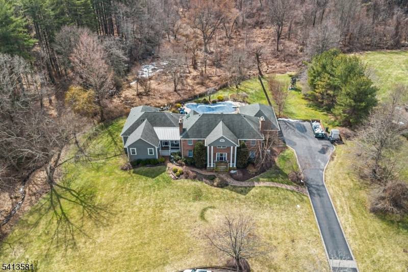 Welcome to an exceptional 5, 147 sq ft multi generational home nestled on a quiet cul de sac surrounded by beautifully preserved wooded land offering privacy, tranquility timeless charm.