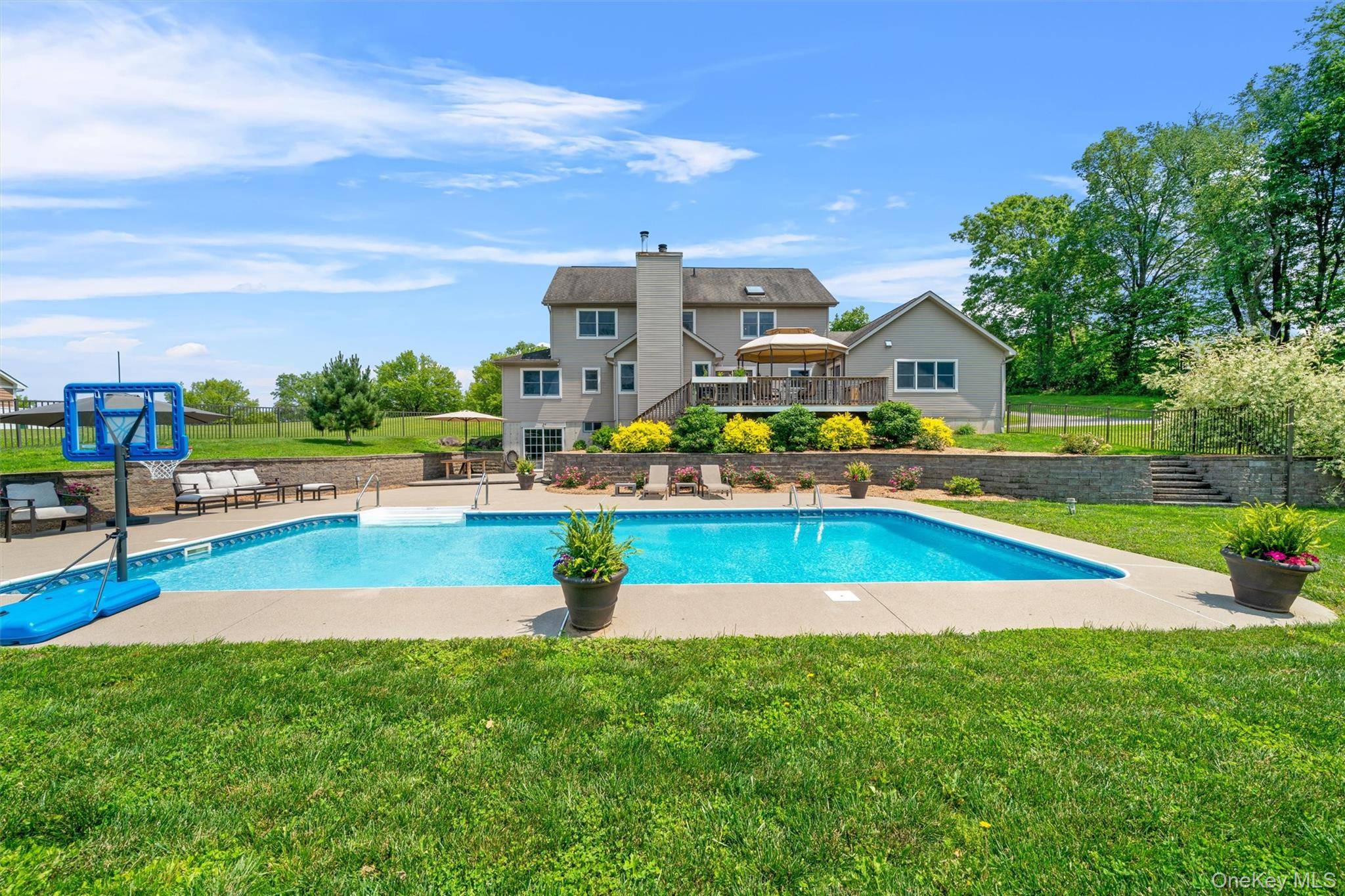 Nestled on a quiet, tree lined street in the coveted Tranquility Estates of Hamptonburgh, this beautifully maintained 4 bedroom, 3.