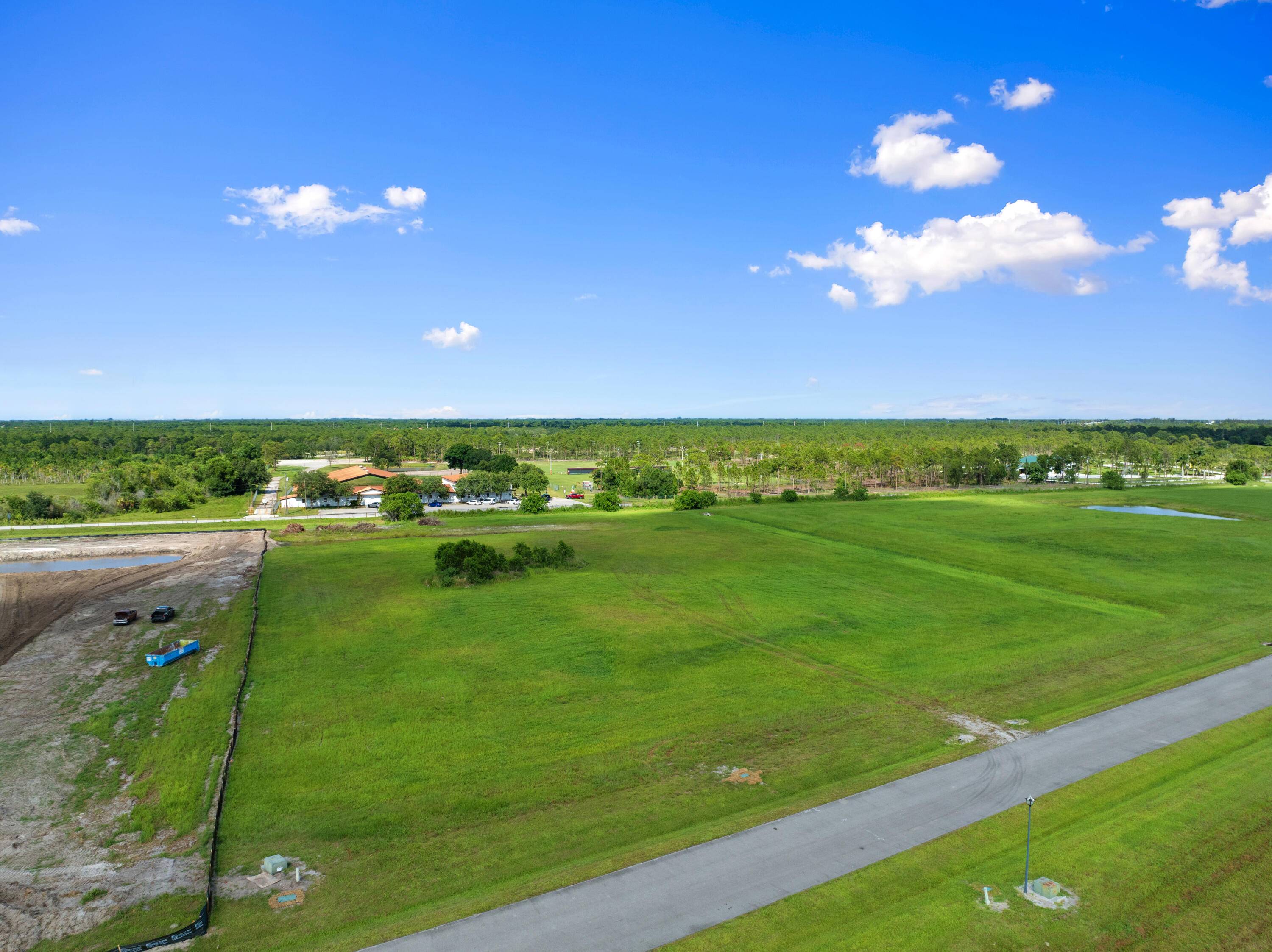 5 acres cleared lot with culvert to property with added fill for house pad small pond.