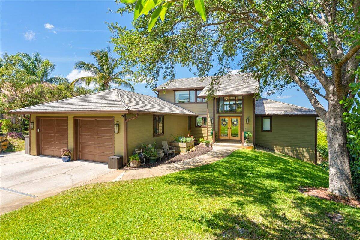 Perched atop one of Florida's highest elevations and offering sweeping views of Henderson's Pond and the Savannas Preserve, this extensively renovated 3 story home boasts 5 bedrooms, 3.