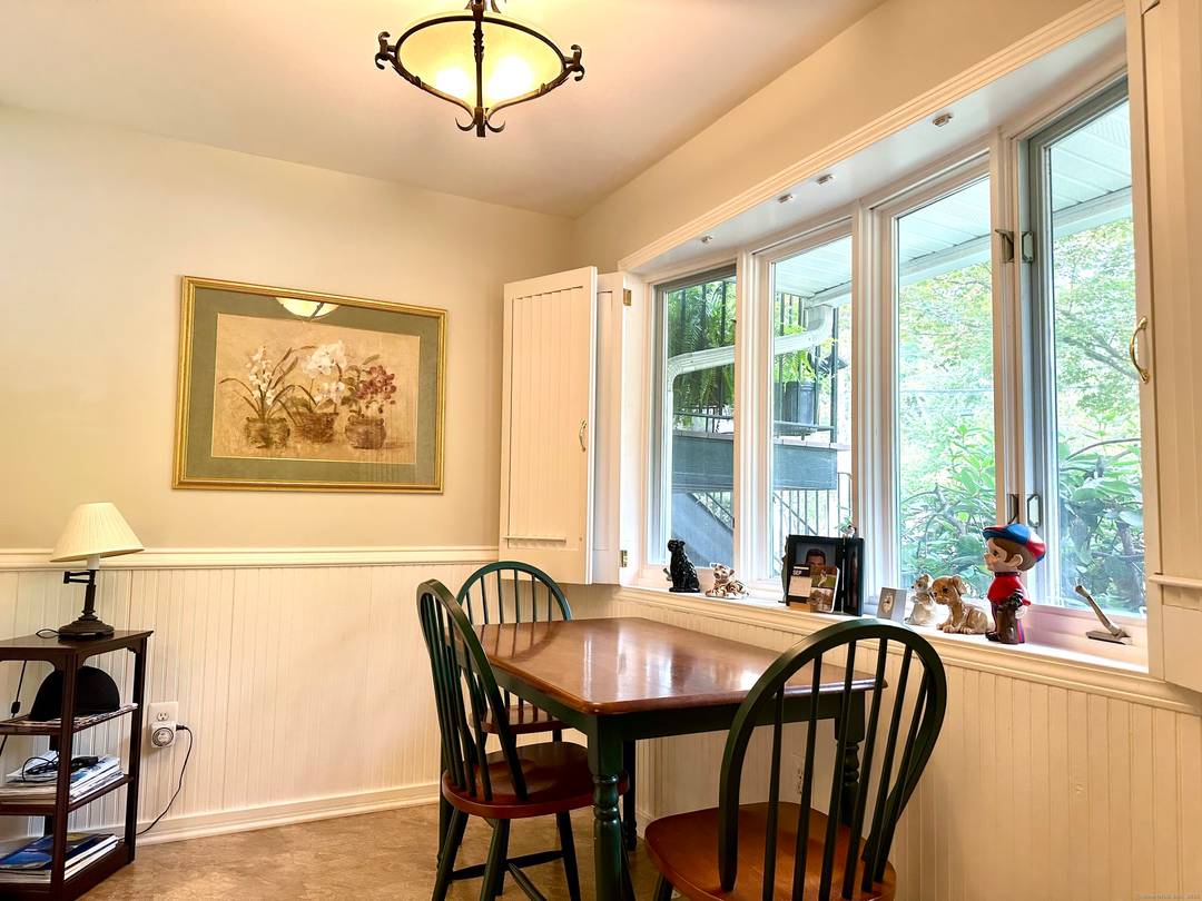 Lovely two bedroom ranch style condo with many appealing features hardwood floors, fireplace, central air, breakfast room off of the kitchen, balcony, lower level family room, a private storage room ...