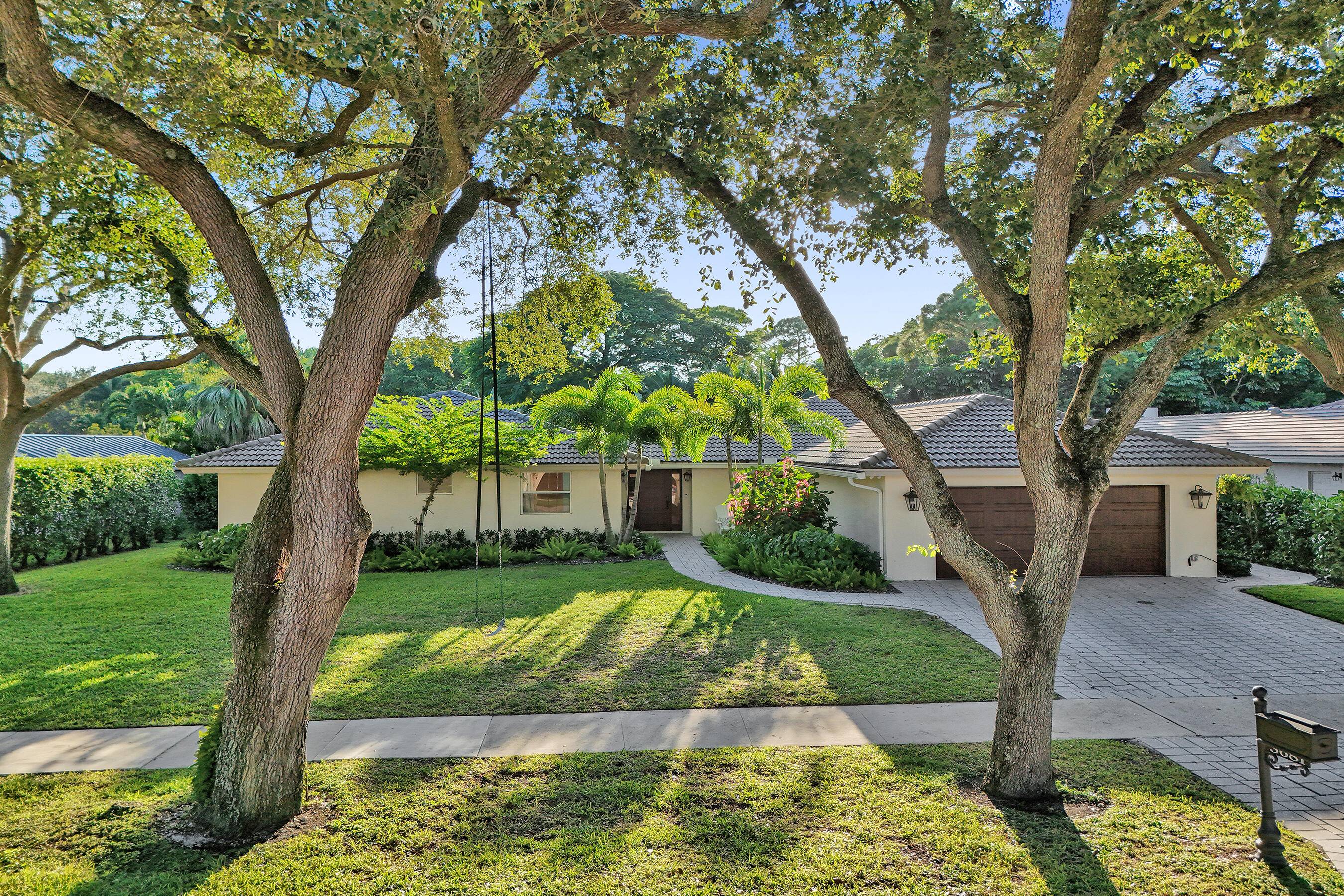 Indulge in a modern, chic, private tropical paradise in this charming single story 4 bedroom plus office, 3.