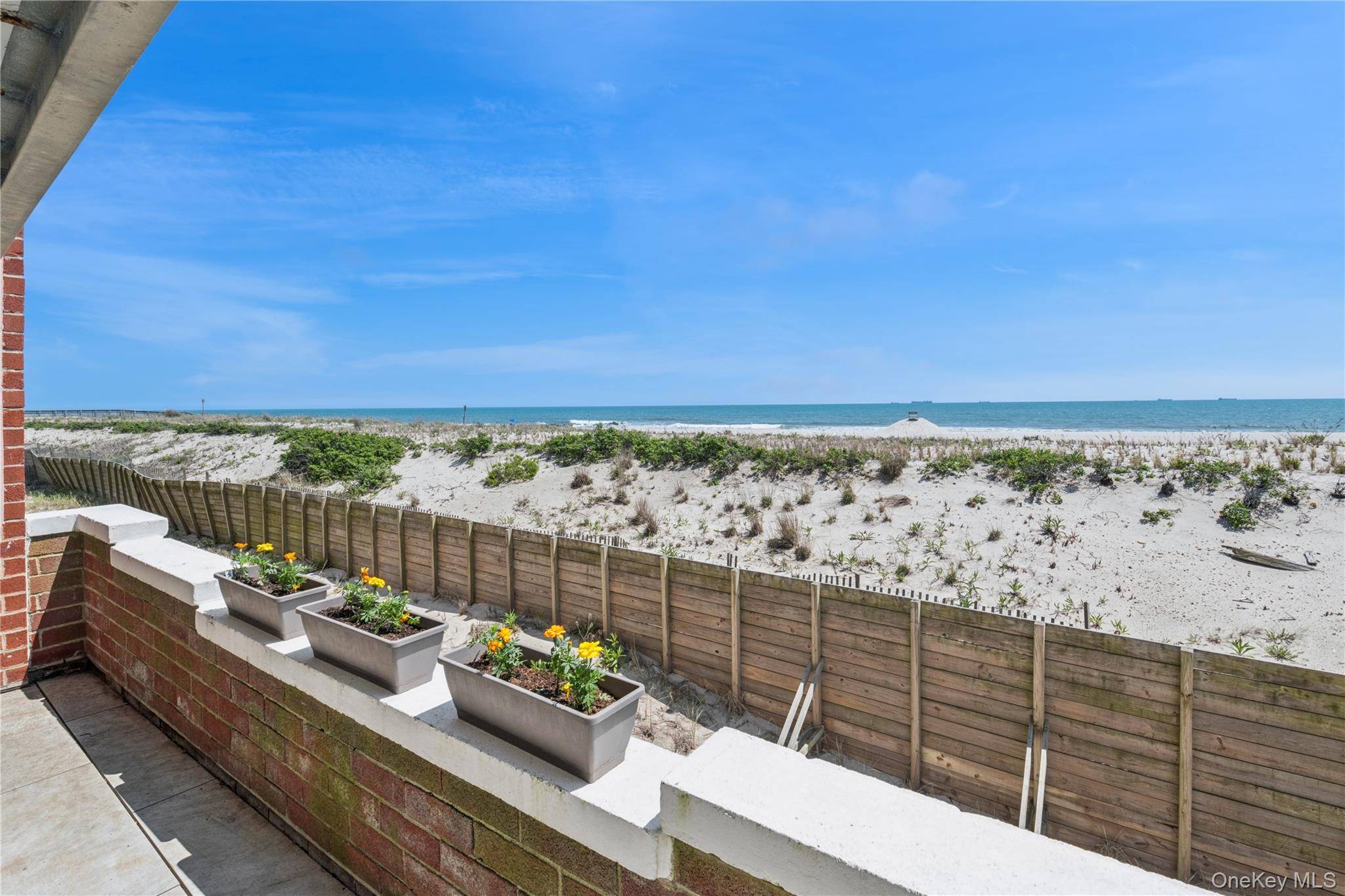Welcome to a rare beachfront gem offering uninterrupted, panoramic views of the Atlantic.