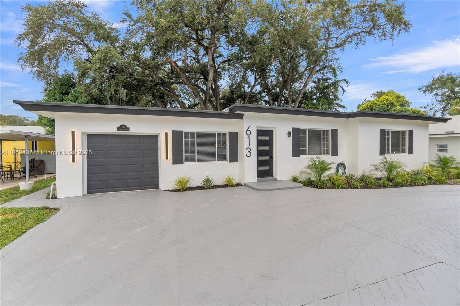 Welcome to this beautifully remodeled home featuring three spacious bedrooms and two updated bathrooms.