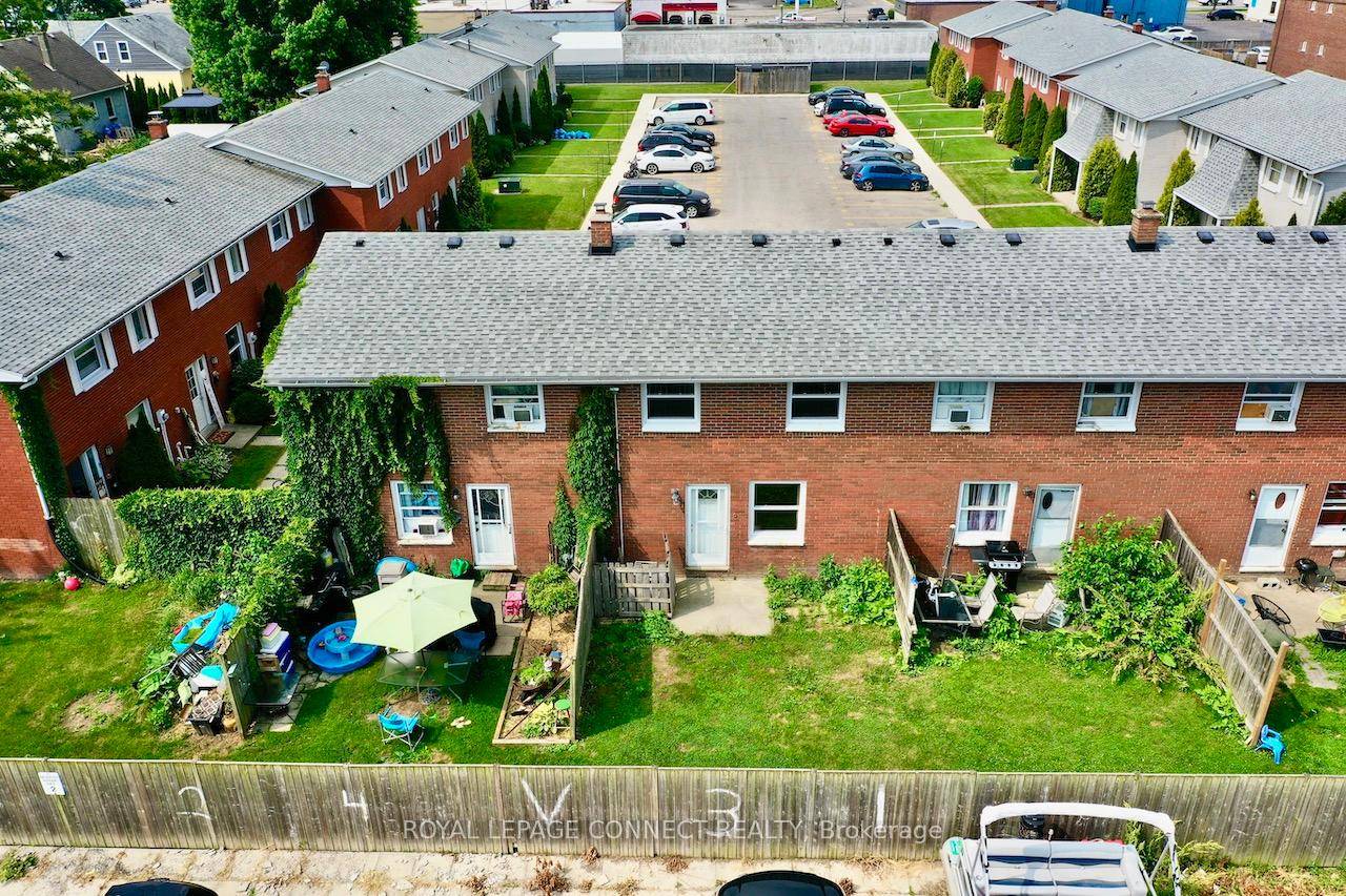 All brick centrally located well established 2 storey, 3 bedroom, 2 washroom condominium townhome with own exclusive parking, and sizeable useable unfinished basement, laundry area, and gas forced air heating.