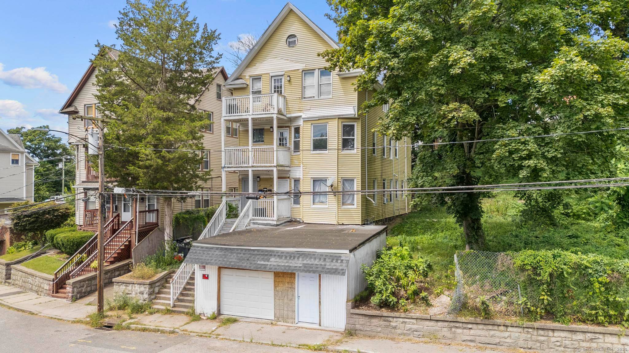 CASH FLOWING w 10 CAP actual TURN KEY 3 family with bonus apartment adjacent lot for sale in the North End of Waterbury.
