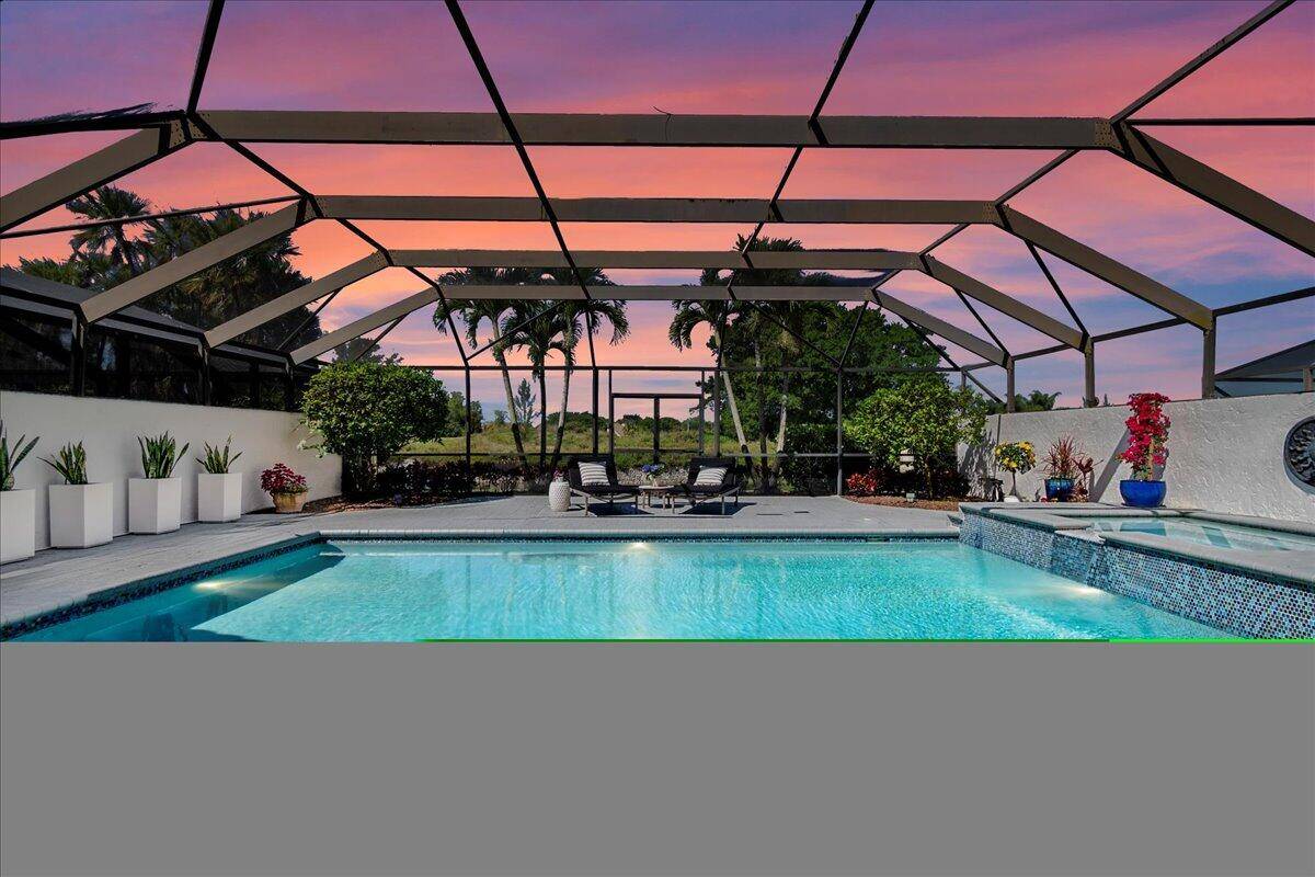 Bask in unparalleled luxury in this stunning oversized corner property, featuring an expansive covered patio, pool, and spa.