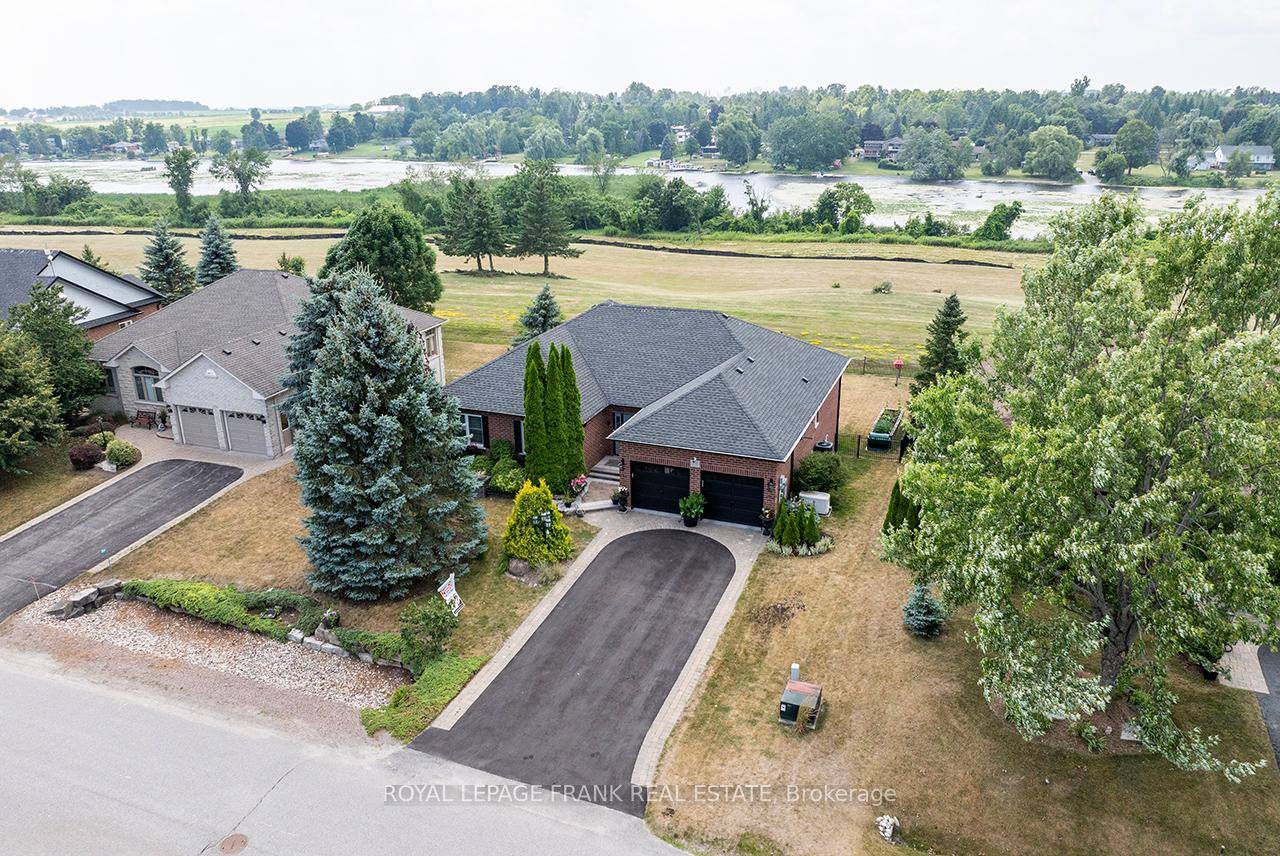 Nestled in the Prestigious King's Bay Lakeside Community approximately 15 minutes from charming Port Perry, this Meticulously Maintained Brick Bungalow features Western Exposure amp ; Breathtaking River views.
