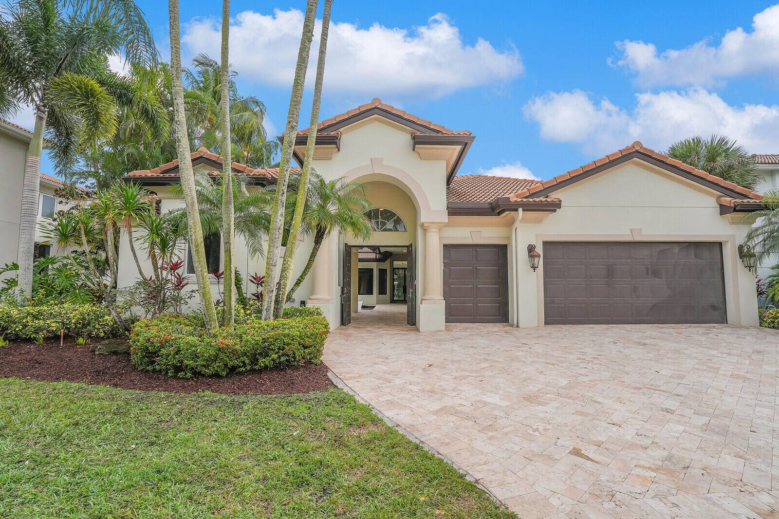 Experience unparalleled elegance in this fully renovated 3, 600 sq ft courtyard home, nestled within the distinguished Mizner Country Club in Delray Beach.