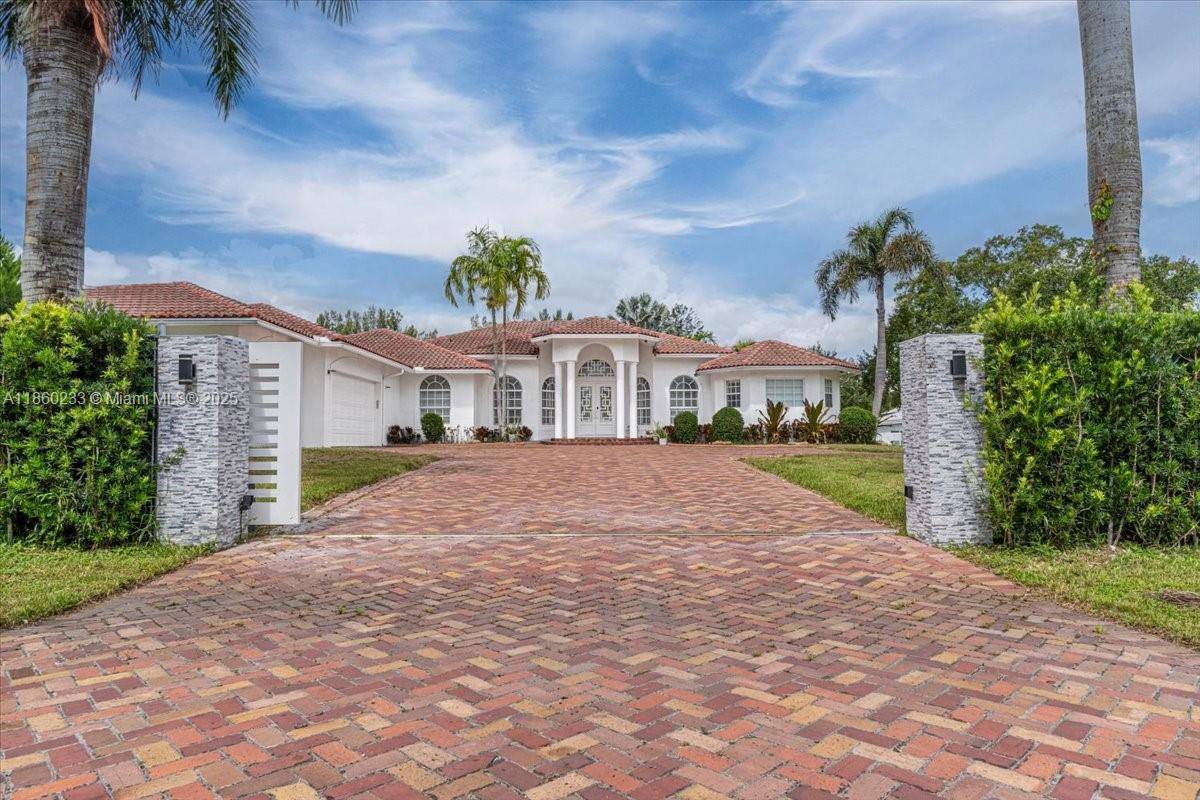 Amazing estate in 2 acre lot in the desired Southwest Ranches.