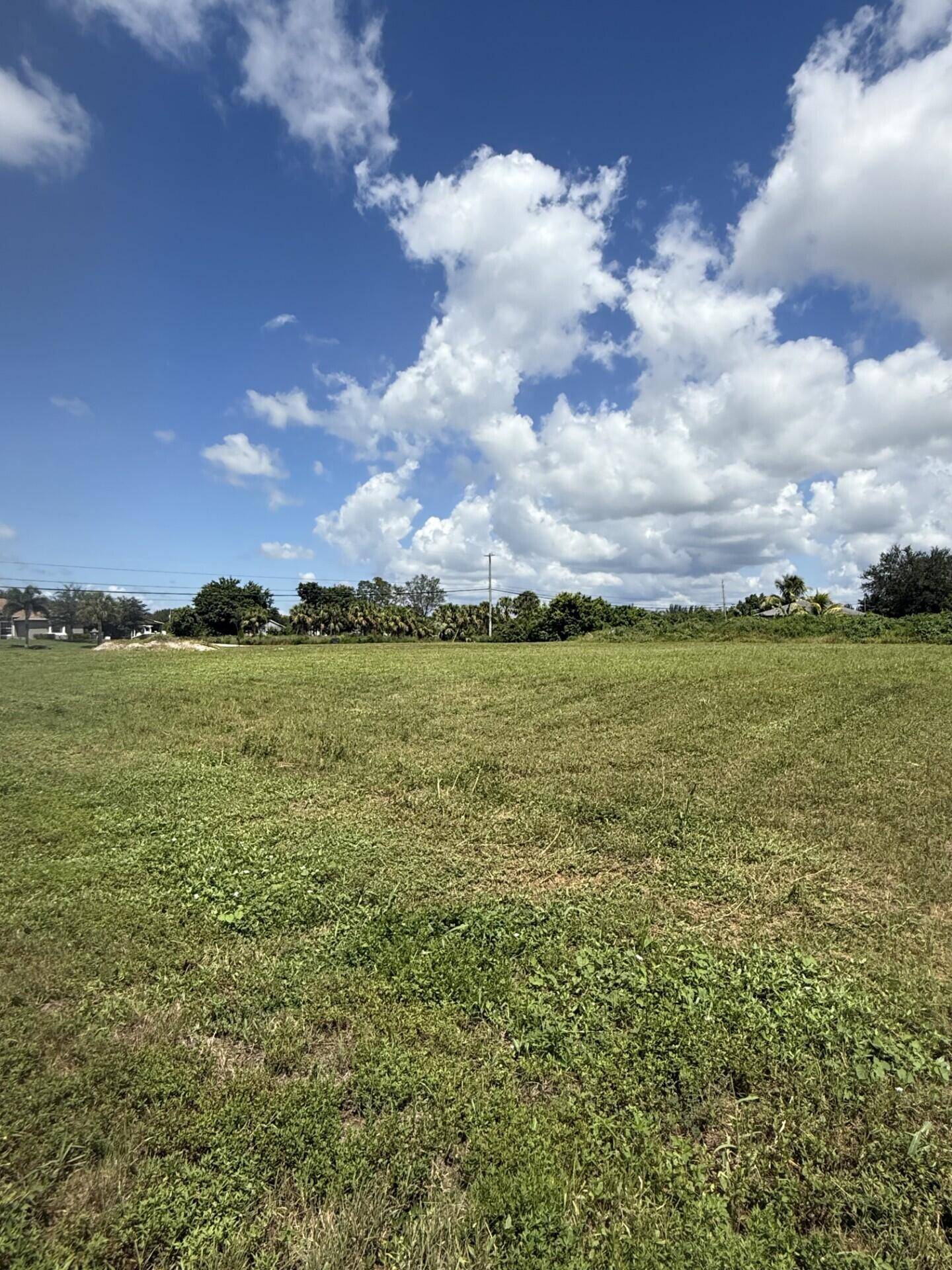 Prime corner homesite on paved Mandarin Blvd 35th Ct N in The Acreage.