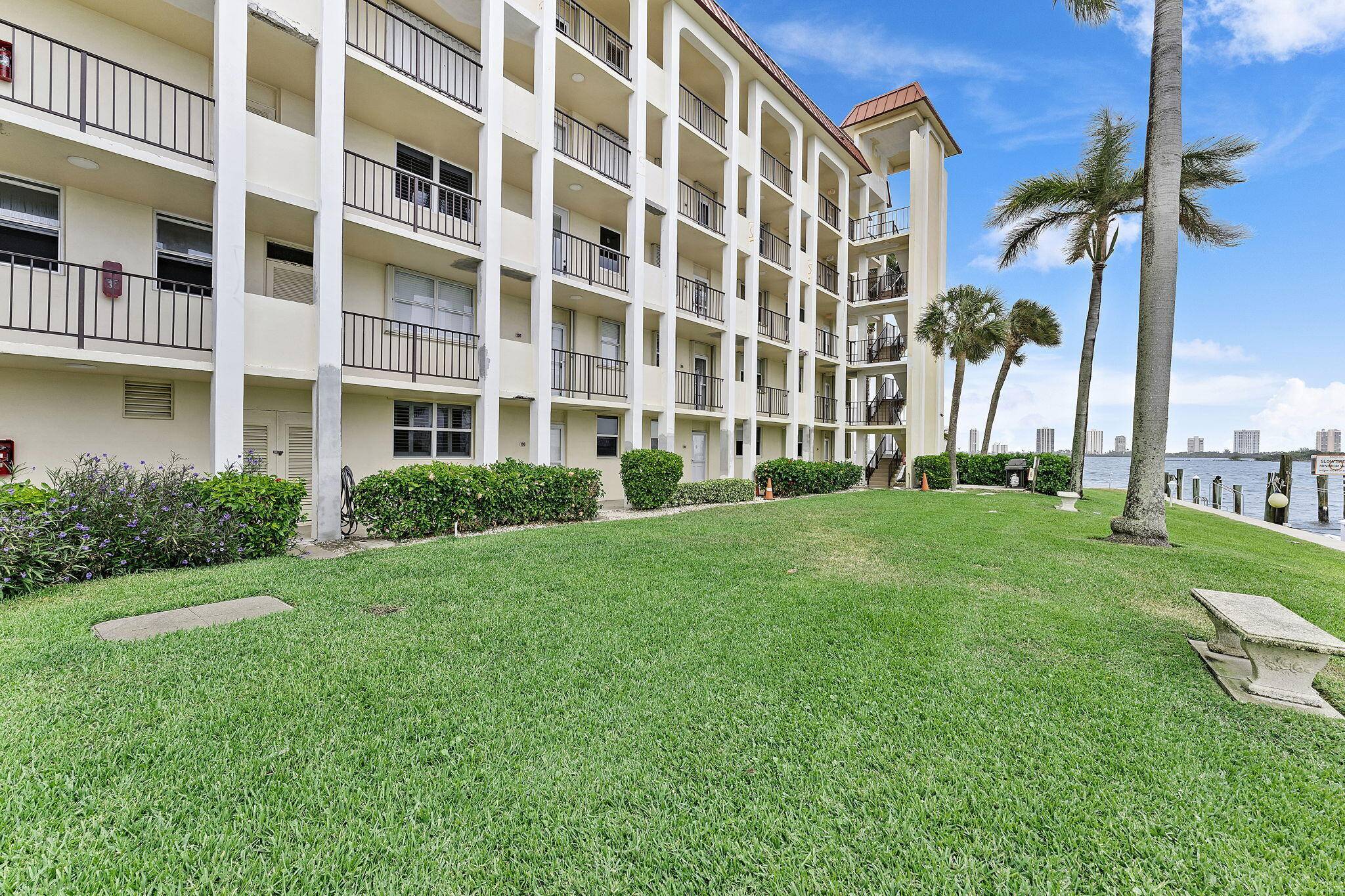 Live the beachy dream in this charming beach style first floor condo in North Palm Beach !