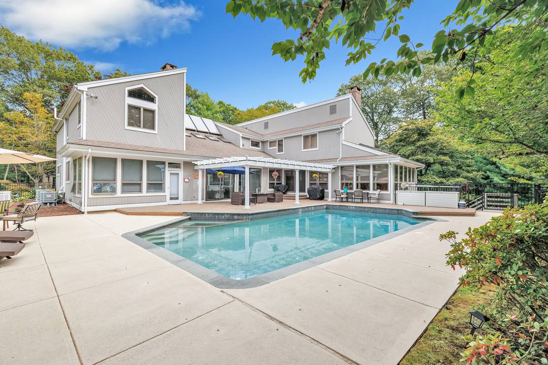 One of a kind contemporary in the Berries of Huntington offering over 7, 000 sq ft of living space on a private 1.