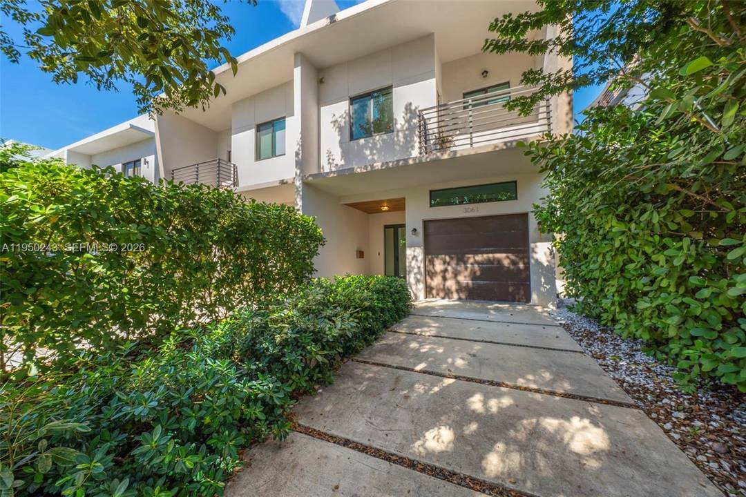 Discover elevated urban living in this turnkey townhouse completed in 2021.